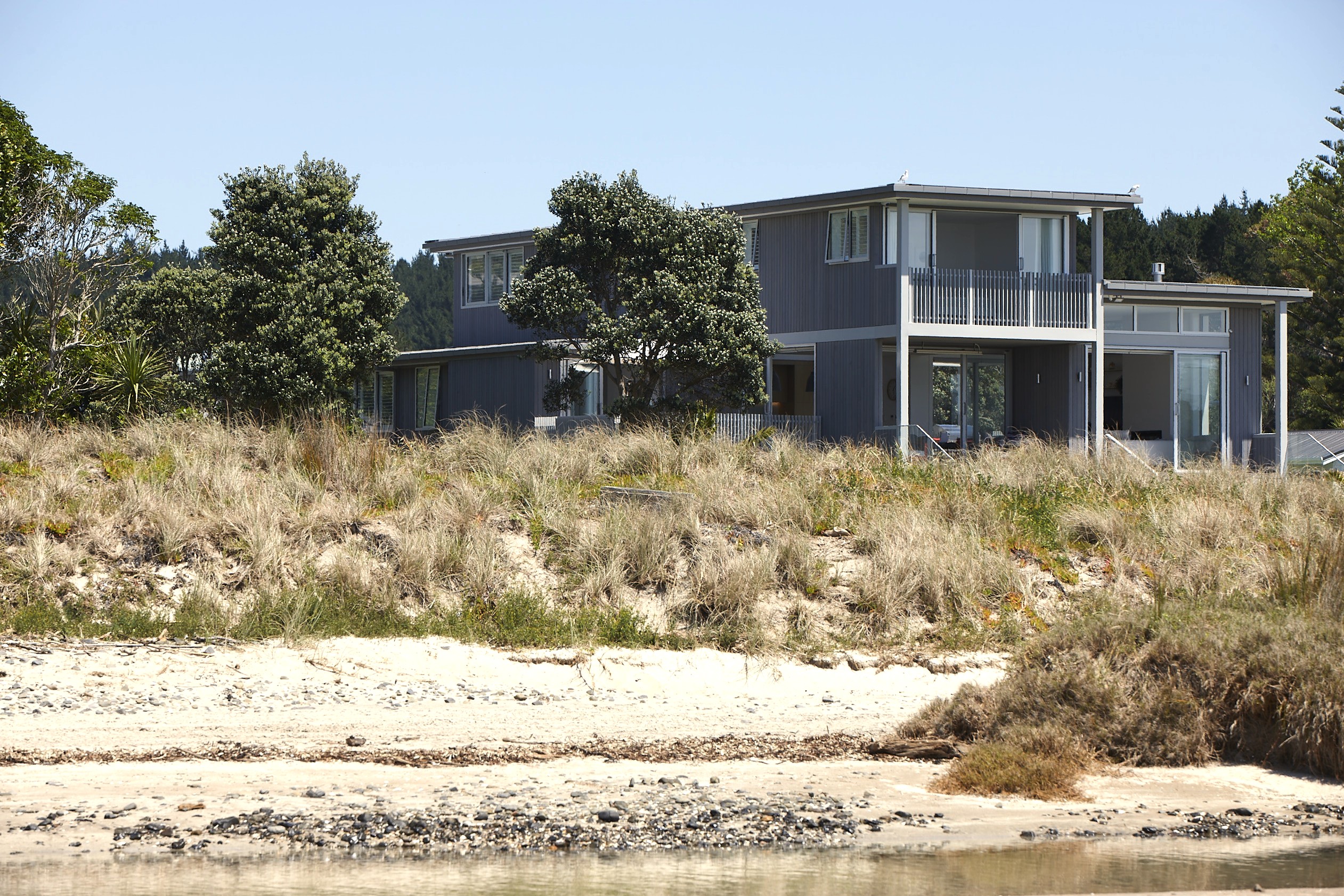 Cedar clad north elevation, beachfront holiday home, Opito Bay