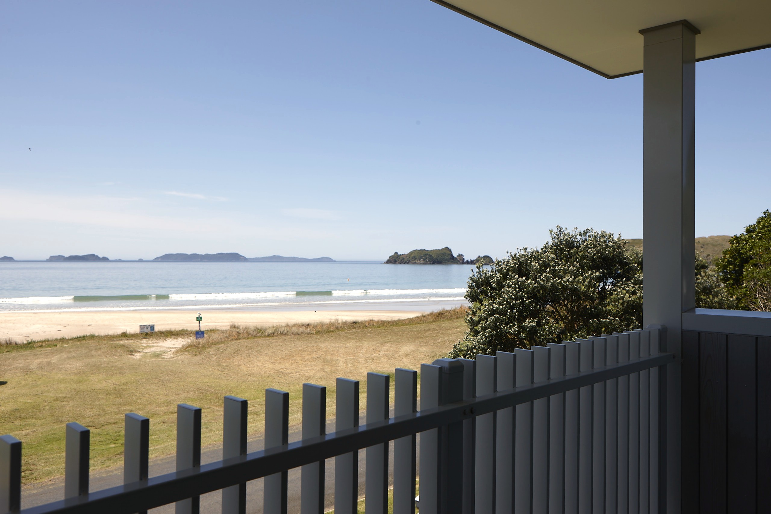Beach front bedroom view, Coromandel. Holiday Homes Architect