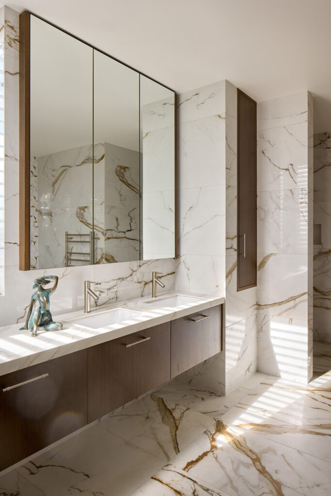 Generous ensuite cabinetry with laundry chute, new house Mission Bay