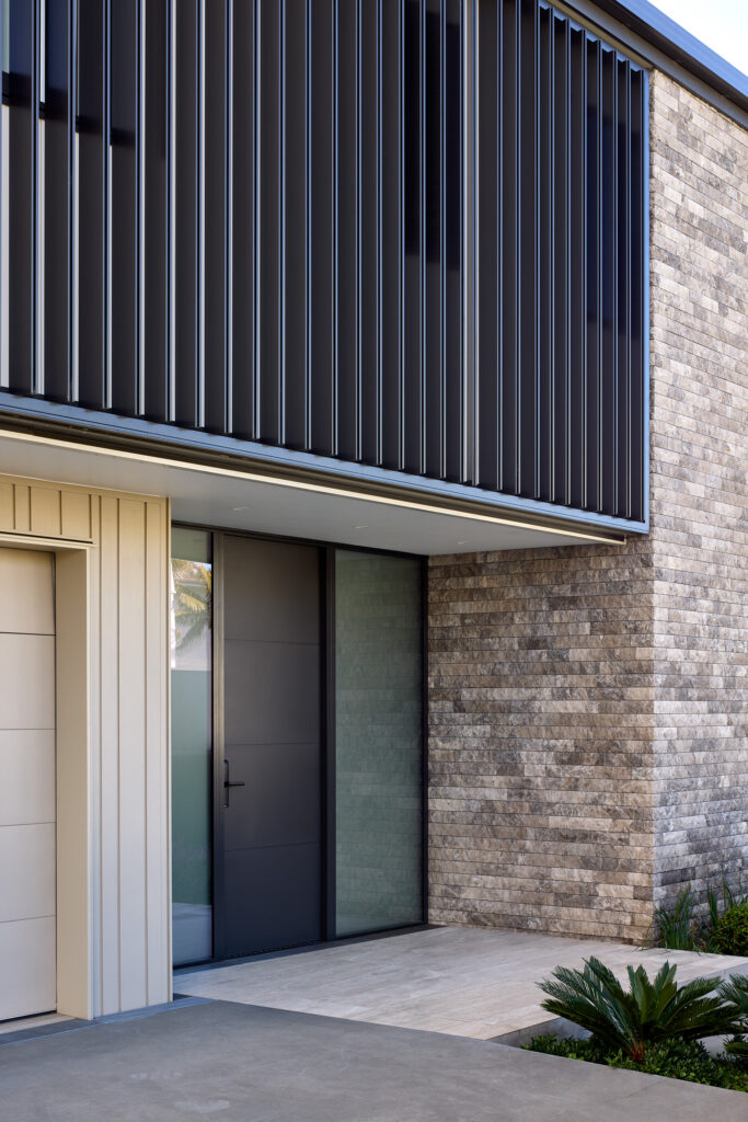 Three-storey new build, Mission Bay — Emperador marble, Nuwall cladding, and Abodo weatherboards