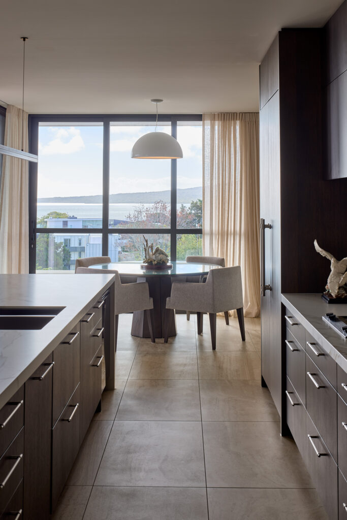 Dark oak cabinetry and marble benchtop detail, Mission Bay forever home