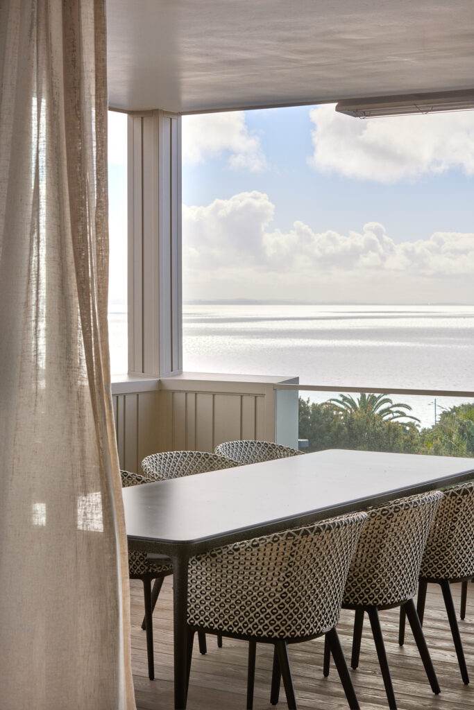 Open-plan living area with Mission Bay harbour views, two-storey new build