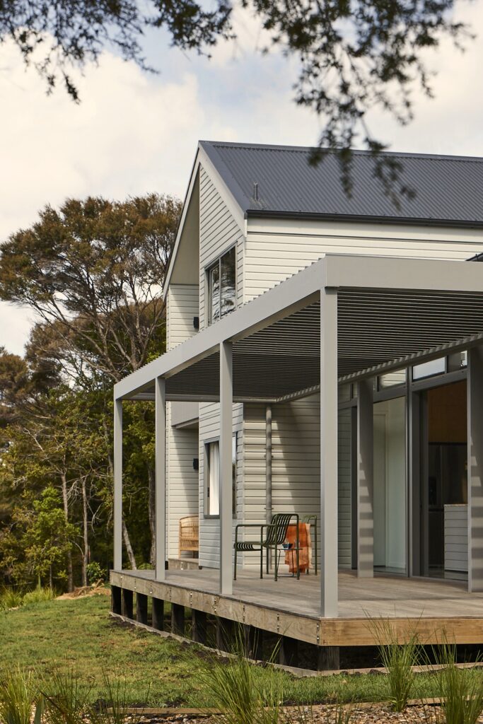 Waipu new house with louvretech roof over deck to view