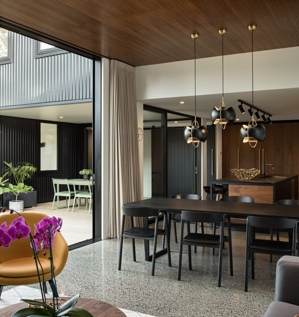 Living area with brass detailing, Westmere family home
