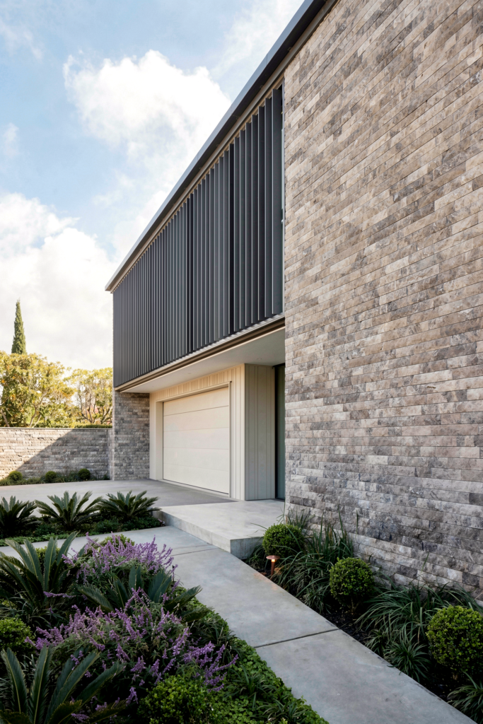 Three-storey new build, Mission Bay — Emperador marble, Nuwall cladding, and Abodo weatherboards
