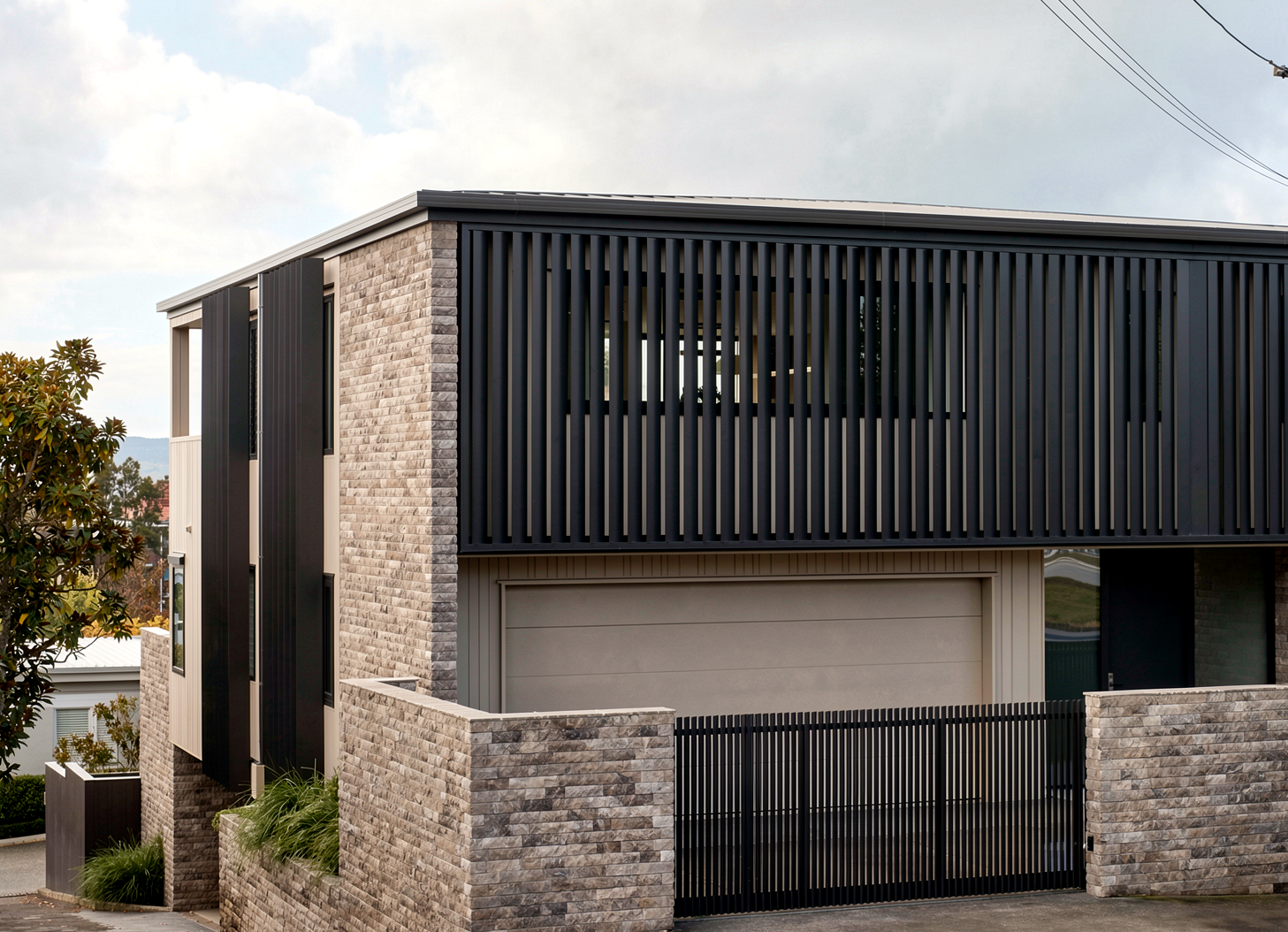 Three-storey new build, Mission Bay — Emperador marble, Nuwall cladding, and Abodo weatherboards